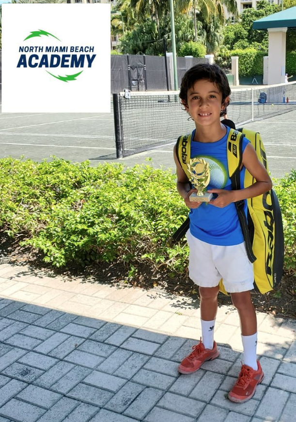 Mateo with tournament trophy — NMBA junior tennis champion