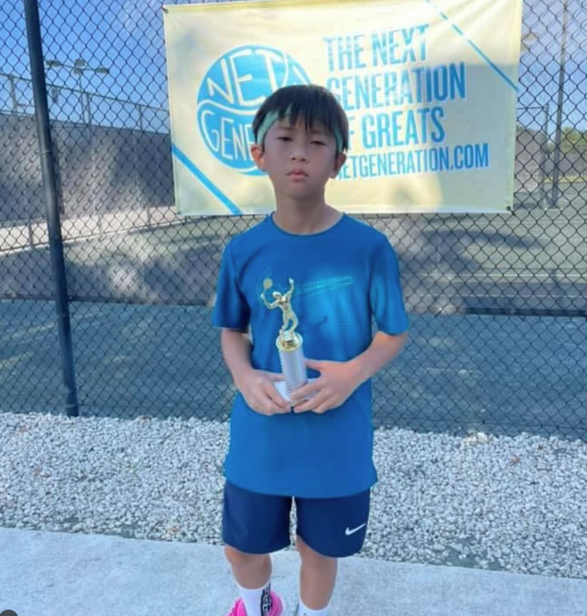 Min Gook Cho with tournament trophy — NMBA junior tennis champion