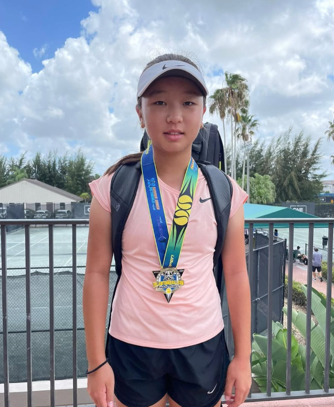 Se-A Cho with tournament trophy — NMBA junior tennis champion