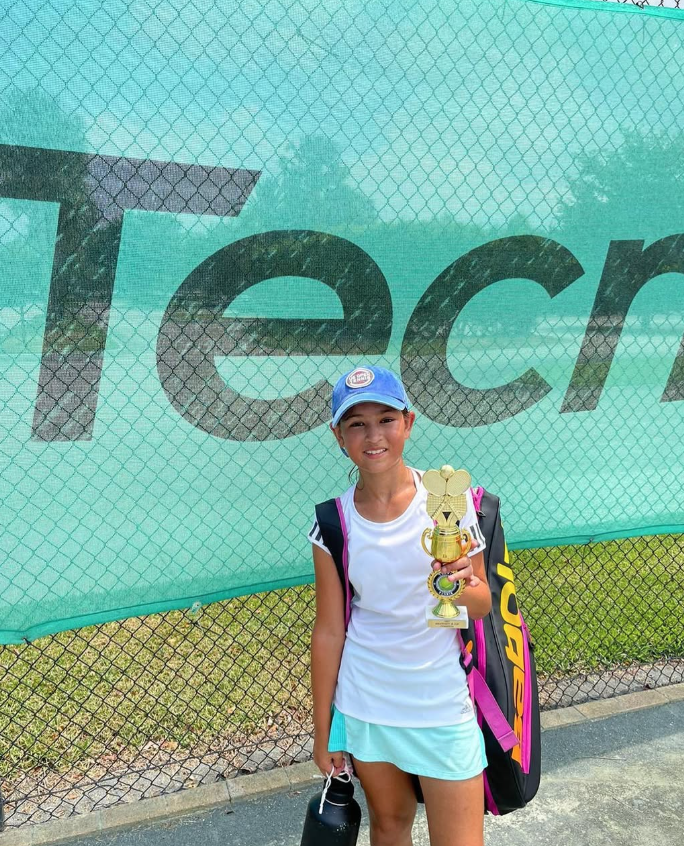 Aurelia Zaffuto championship trophy moment — NMBA elite junior tennis player