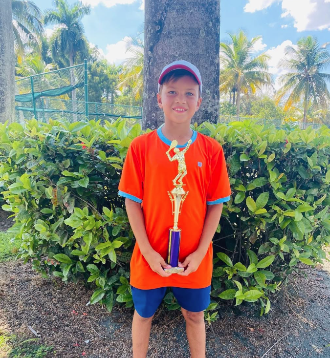 Illia Vlasov tournament trophy photo — NMBA junior tennis success story