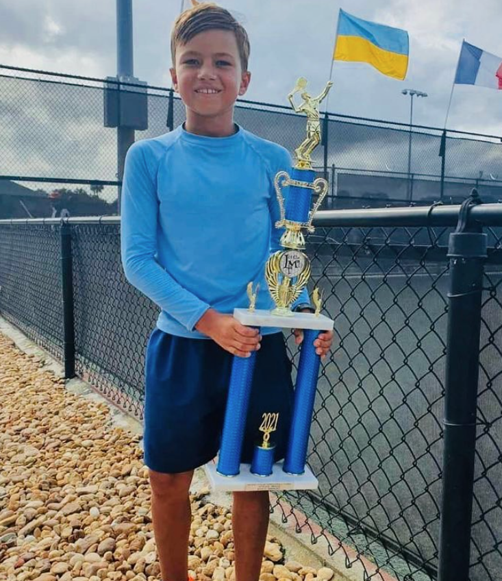 Illia Vlasov championship celebration — NMBA elite junior tennis player