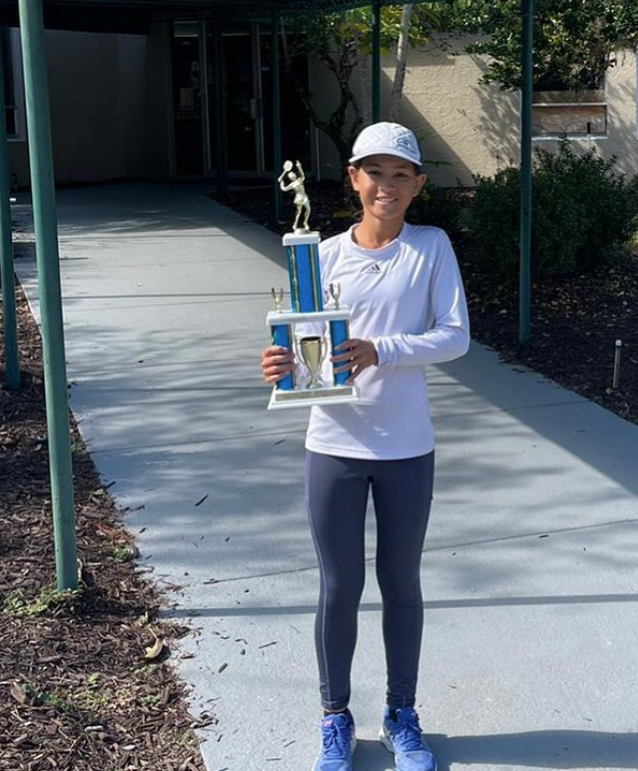 Aurelia Zaffuto with championship trophy — NMBA junior tennis success