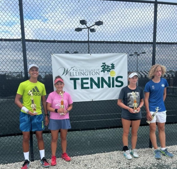 Michelle, Sonya, Frank and Loic celebrating tournament victory — NMBA junior tennis team champions